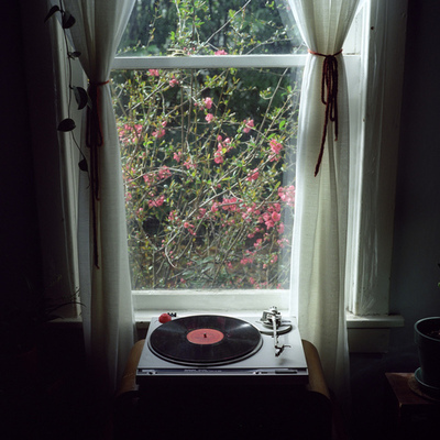 Recor player in front of window