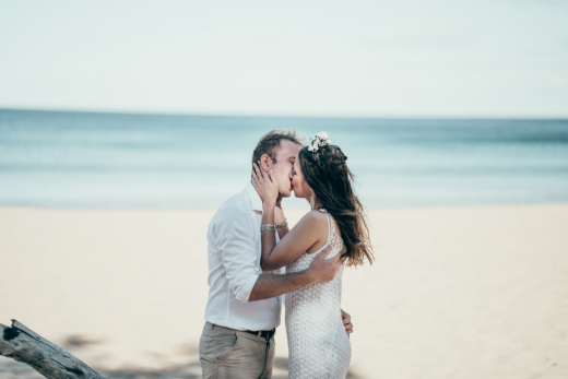 Couple kiss during beach ceremony Andrea Calodolce Marriage Celebrant Sydney