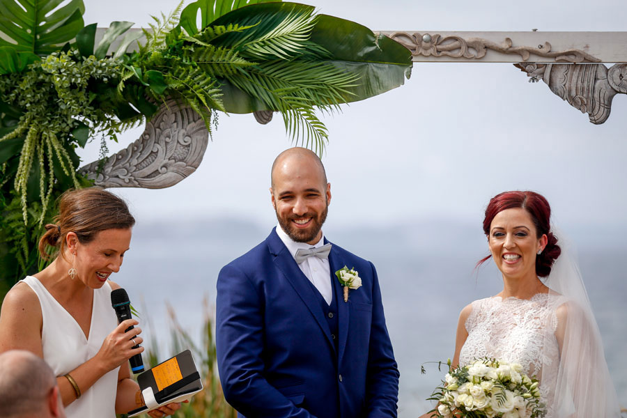 Bride, groom and celebrant at beach wedding